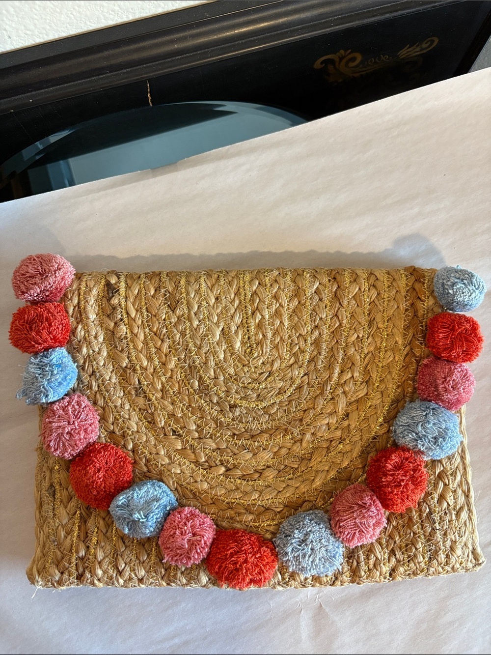 Straw Clutch with Colorful Pom Poms and gold lamé straw